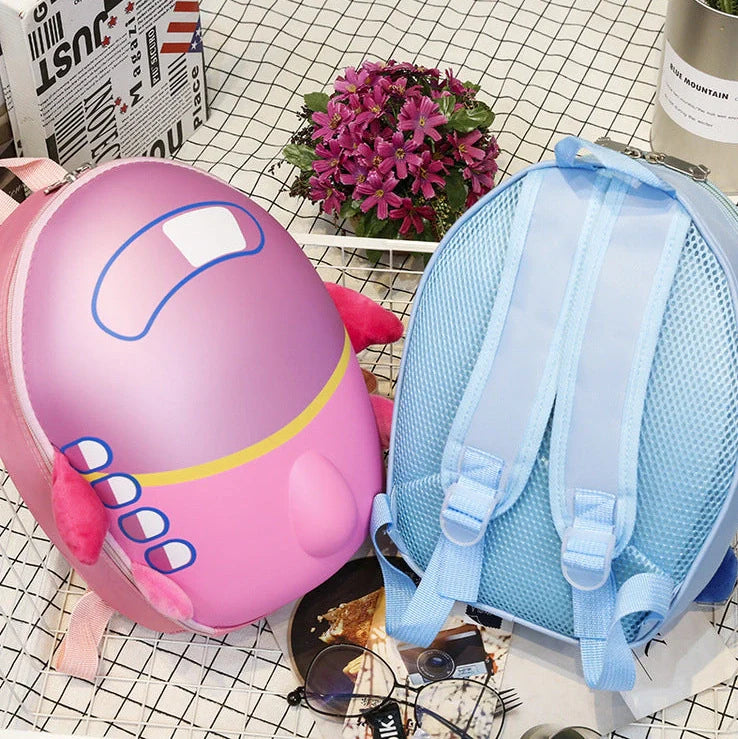 Blue aircraft-shaped children's hard shell backpack with cartoon graphics and adjustable shoulder straps