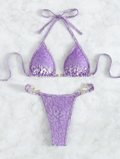 Women's blue leopard print T-shaped bikini set for swimming on a mannequin.