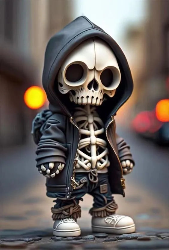 A 15cm tall resin skeleton figurine ornament on a desk.