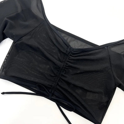Black mesh long sleeve women's bikini four-piece swimsuit set on a white background.
