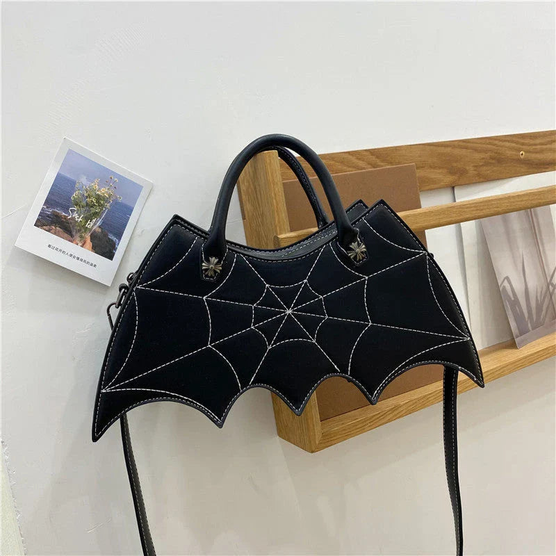Stylish Halloween spider web crossbody bag in various colors, including black, white, brown, pink, and purple
