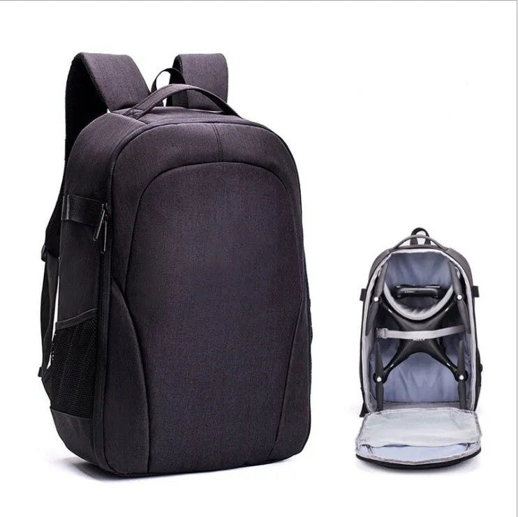 Black Oxford cloth waterproof backpack open to show internal camera, laptop, and organiser pockets