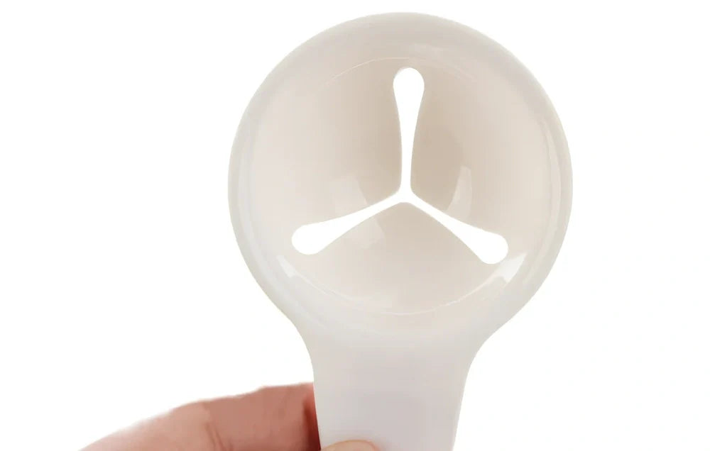 White ABS plastic egg separator with 10cm handle and 7.3cm bowl for yolk separation