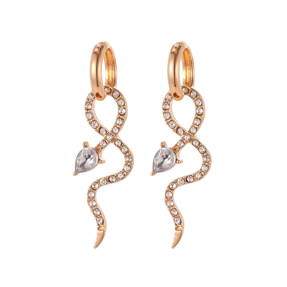 Pair of golden snake-inspired dangle earrings with a captivating and elegant design