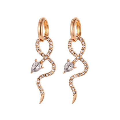 Pair of golden snake-inspired dangle earrings with a captivating and elegant design