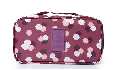 Compact travel underwear organizer in navy blue, 28cm x 14cm x 14.5cm with mesh pockets for packing