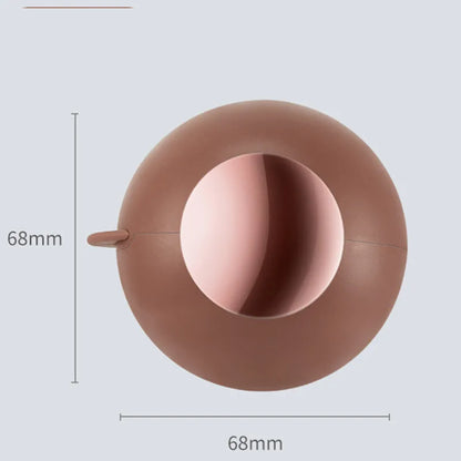 Green Gold reusable gel lint roller ball for removing pet hair from fabrics.