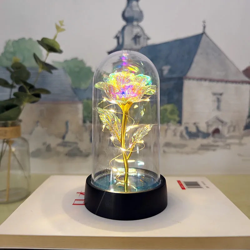 Glass cover small night lamp with plastic flowers, 15cm height, black base, showing colour light options