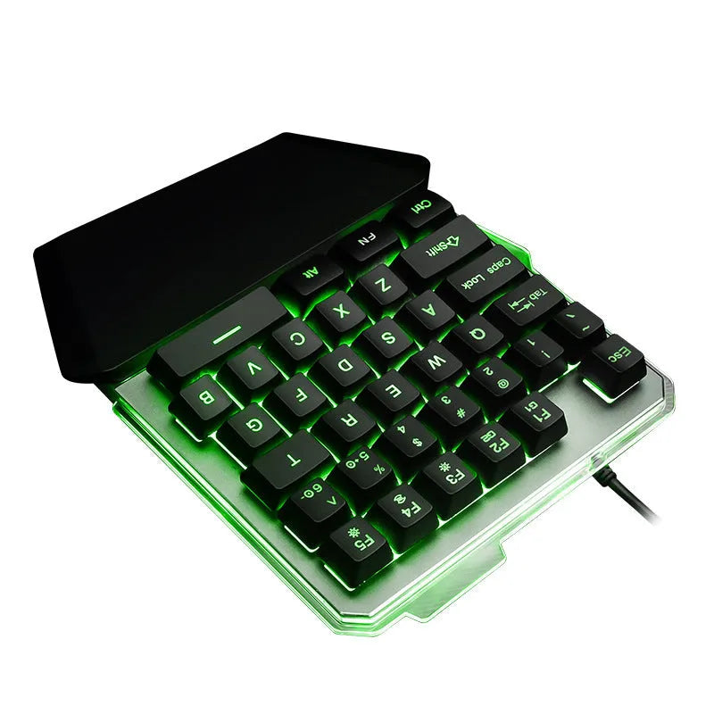 Black one-handed keyboard with RGB backlight and 1.8-metre USB cable on a desk