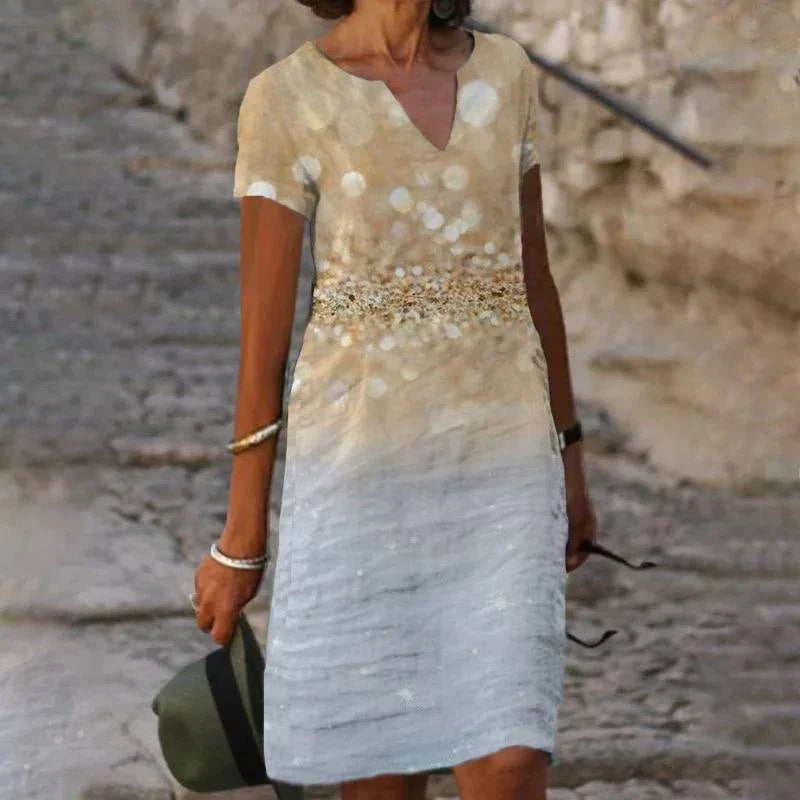 Stylish floral printed mid-length dress made with a cotton-linen blend fabric for a comfortable and feminine look.