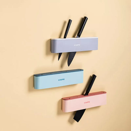Wall-mounted kitchen knife holder in grey, pink, or light blue, semi-open design for better air circulation