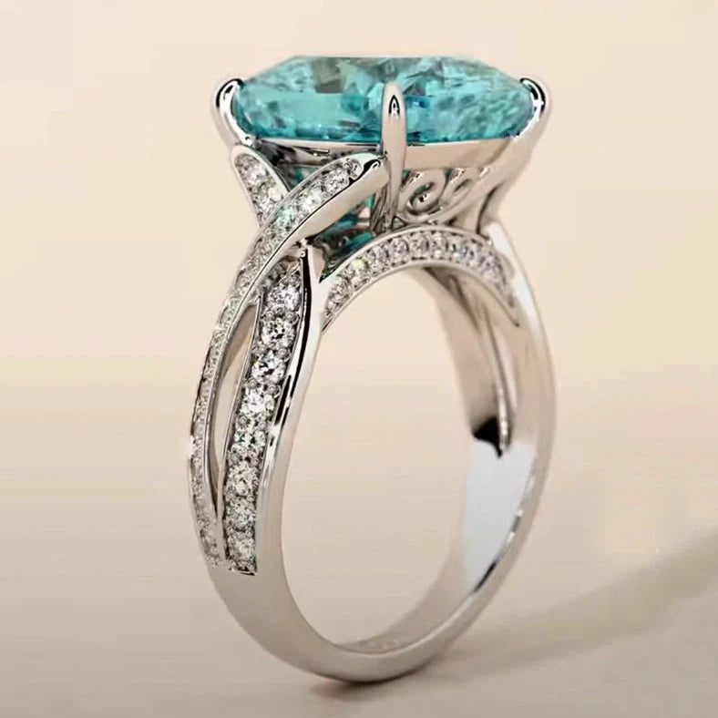 Adjustable women's ring with 4mm square blue zircon stone on silver-tone band
