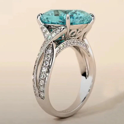 Adjustable women's ring with 4mm square blue zircon stone on silver-tone band