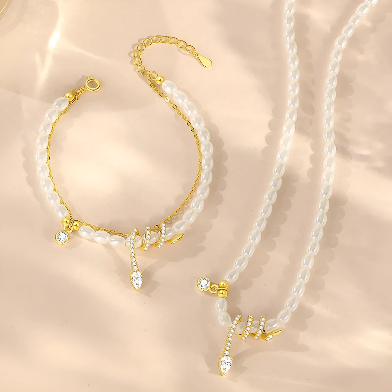 Pearl snake bracelet in 925 silver with electroplated gold or white gold finish and geometric animal design