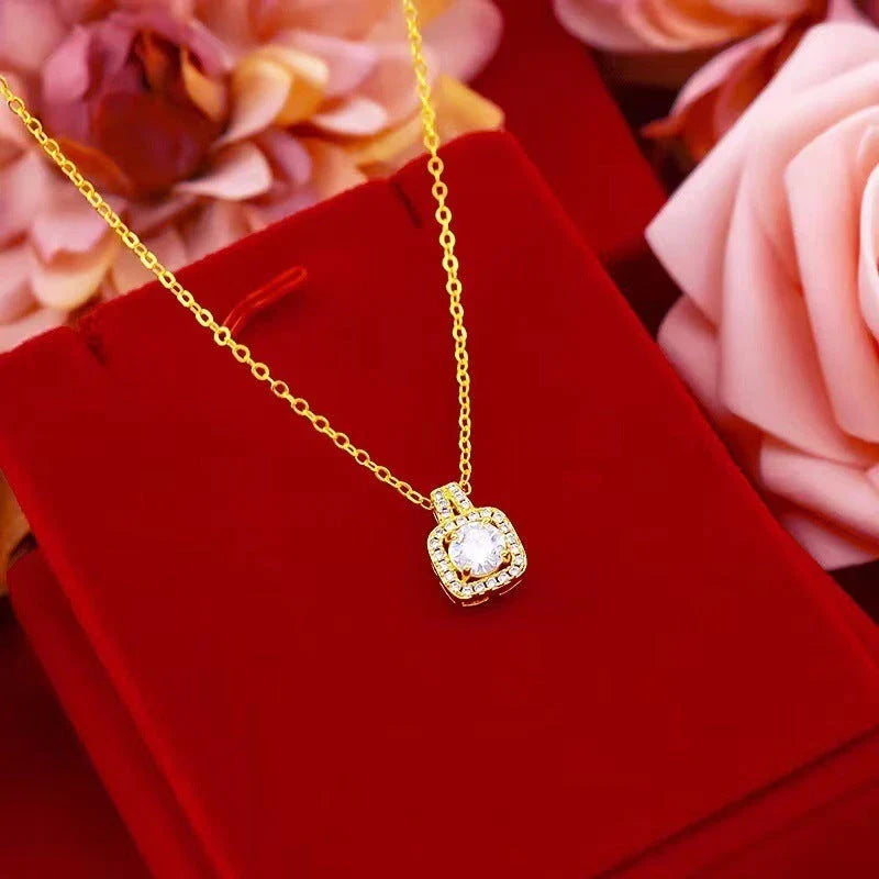 Elegant gold-toned jewelry set including necklace, earrings, and ring with zircon gemstone pendant