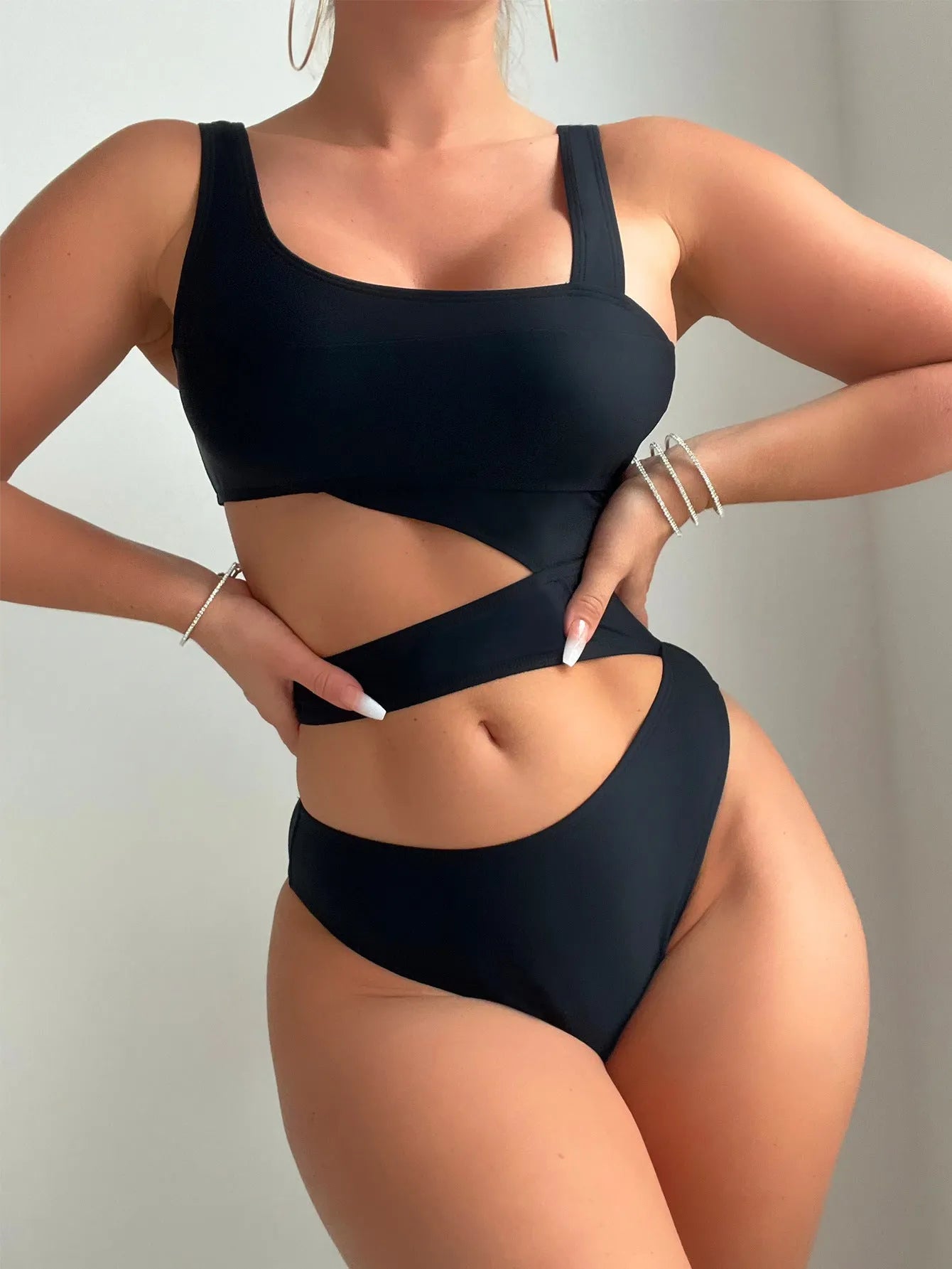 Black high-cut women's one-piece swimsuit with sleeveless design