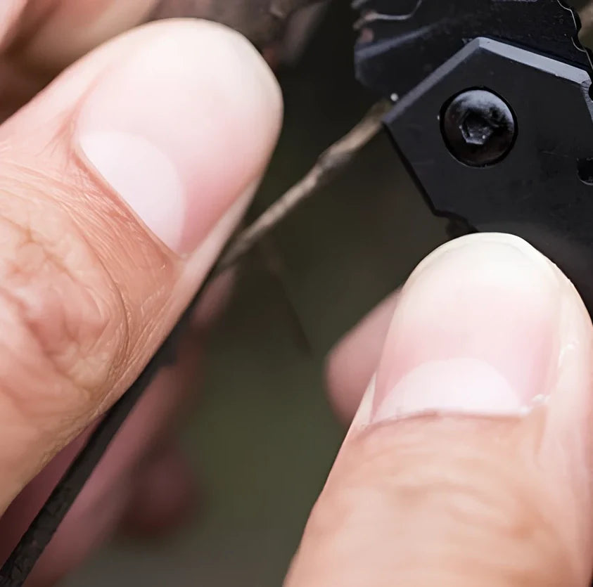 Black pocket folding knife with serrated blade, 85mm length, stainless steel handle