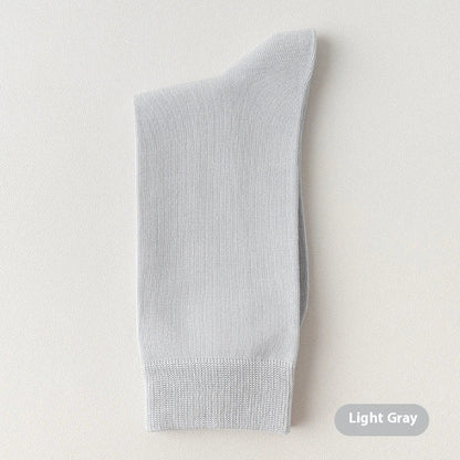 Mid-calf business socks in solid colours with combed cotton construction and deodorant function