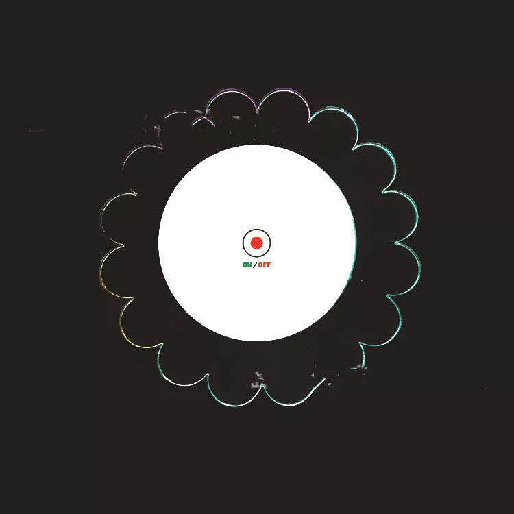 LED Glow Coaster with vibrant colors illuminating a cocktail glass