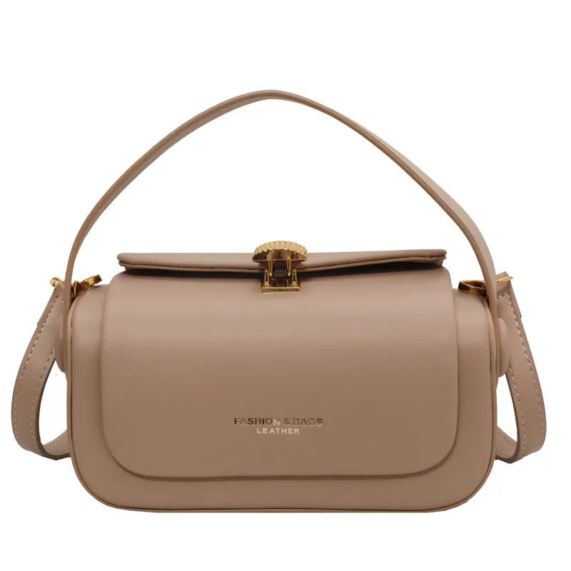 Women's personalised shoulder messenger bag in beige with lettering, showing adjustable strap and reinforced stitching details
