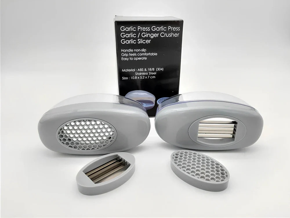 White plastic garlic cutter with stainless steel blades measuring 11cm long