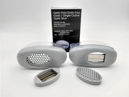 White plastic garlic cutter with stainless steel blades measuring 11cm long