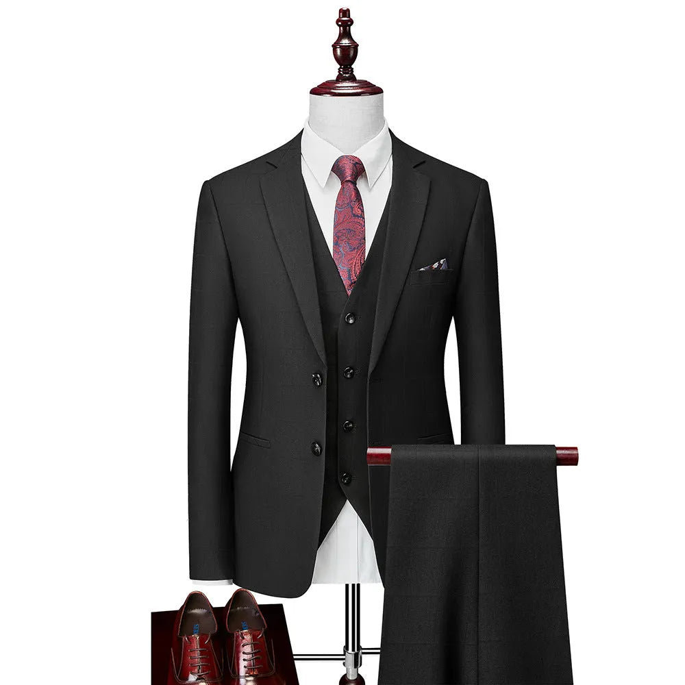 Men's navy blue slim fit three-piece suit with waistcoat on a hanger
