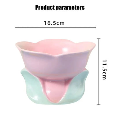 Blue ceramic raised pet bowl with floral pattern and non-slip base for cats or small dogs.