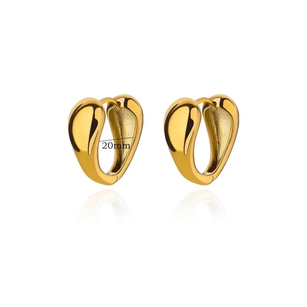 Women's irregular geometric butterfly earrings in copper with diamond treatment, showing heart-shaped and star designs in various colours