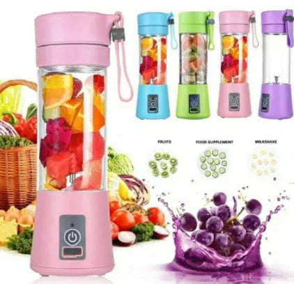 Compact pink portable blender with USB charging cable and box, shown alongside blended fruit smoothie.