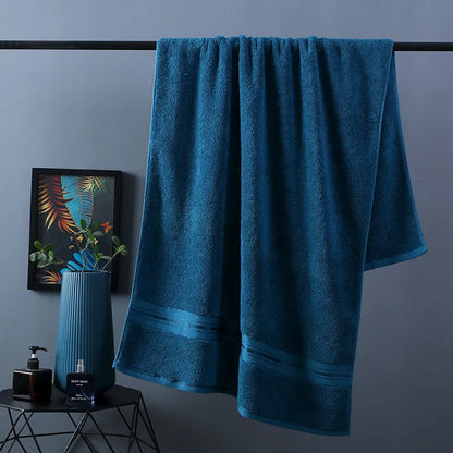 Three-piece cotton towel set showing bath towel, towel, and square scarf in coordinating colours