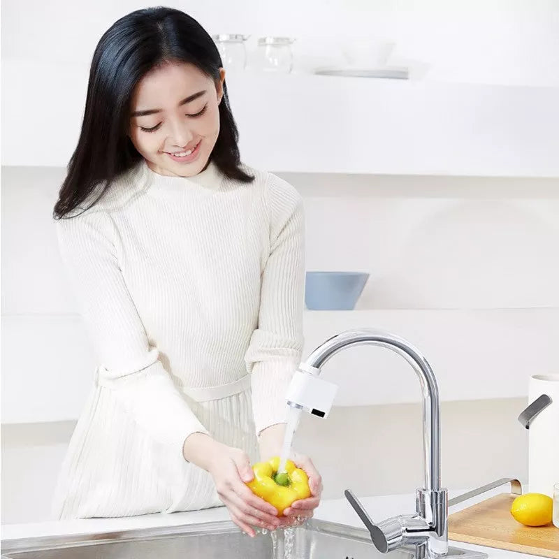 Infrared induction water saving device for faucets with USB charging