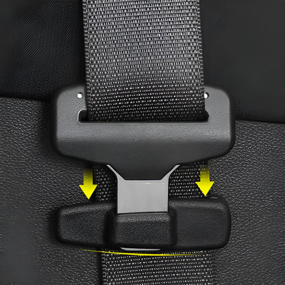 Two black ABS plastic car seat belt stopper clips on a clear OPP bag.