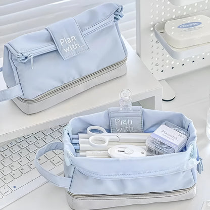 Double-layer folding pencil case showing navy blue colour with pens organised in separate compartments