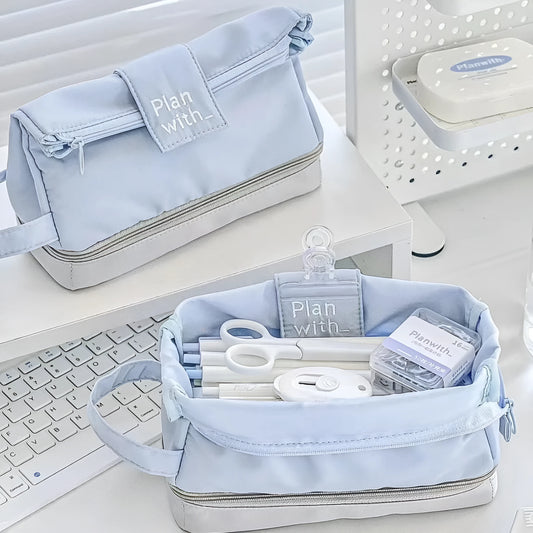Double-layer folding pencil case showing navy blue colour with pens organised in separate compartments