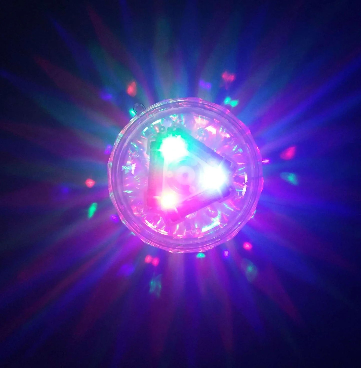 Round water lamp with changing colours submerged in bath, showing blue and purple LED illumination through clear polycarbonate shell
