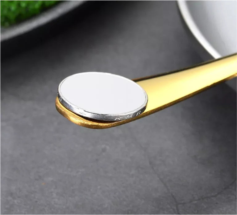 Stainless steel 24-piece tableware set with knives, forks, and spoons in rose gold, black, and gold