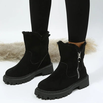 Women's black high top snow boots with a faux suede upper and side zipper on a white background.