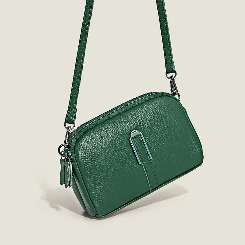 Minimalist top-grain leather crossbody bag in horizontal square shape with inner pockets, available in five colours