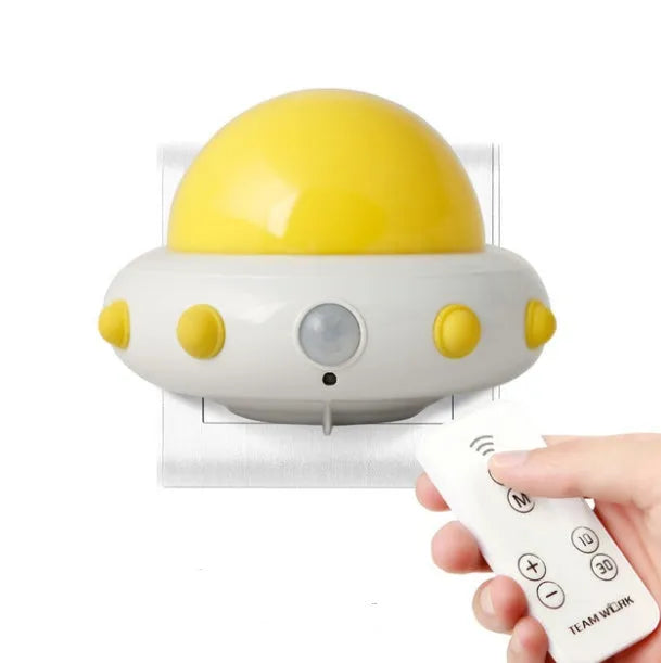 Remote control UFO bedside night light with LED illumination, ABS lamp shade material, 105mm x 76mm x 58mm compact dimensions suitable for home bedroom, corridor, hotel room or gift-giving occasions in blue, pink or white colour options