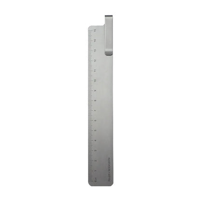 Aluminum bookmark ruler showing 15cm scale with laser-engraved markings in retro design
