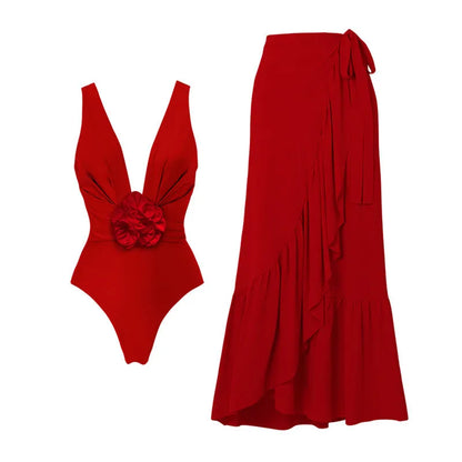 Red one-piece swimsuit with V-neck halter, open back, and a matching long skirt, with a detachable fabric flower.