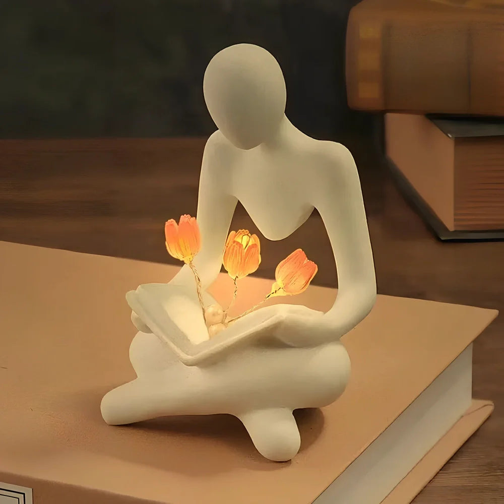 Nordic abstract thinker statue with tulip book night lamp measuring 7x6.3x11.5cm