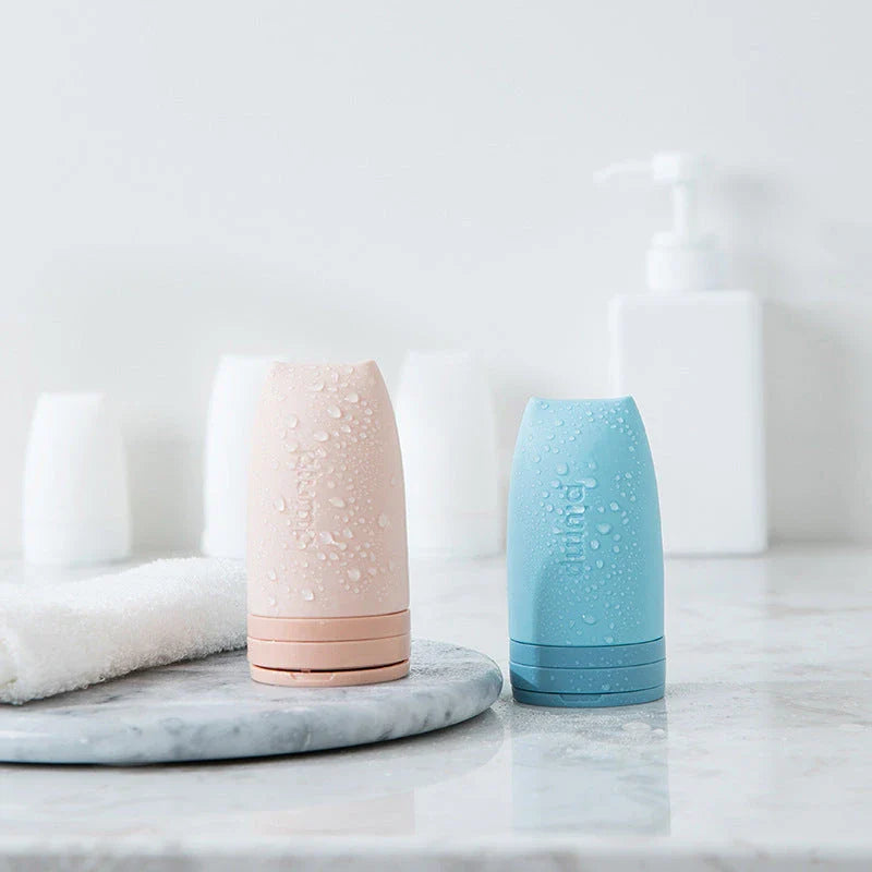 Compact silicone travel bottles for cosmetics, available in multiple vibrant colors and sizes for convenient on-the-go beauty storage and application.