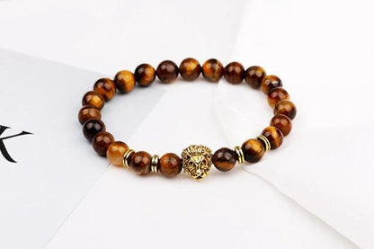 Carved stone bracelet featuring a powerful lion design, meant to enhance confidence and style.