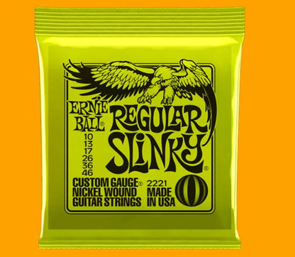 Coils of nickel-plated electric guitar strings and bass strings showing their metallic shine.