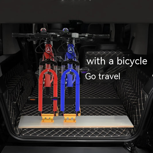 Silver metal quick-release clamp for attaching a bicycle front fork to a vehicle rack.
