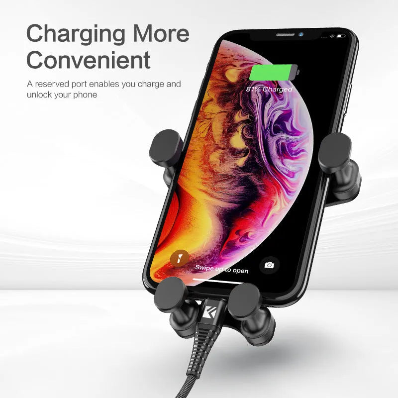 Black car vent phone holder with gravity lock mechanism, shown holding a smartphone at an angle.