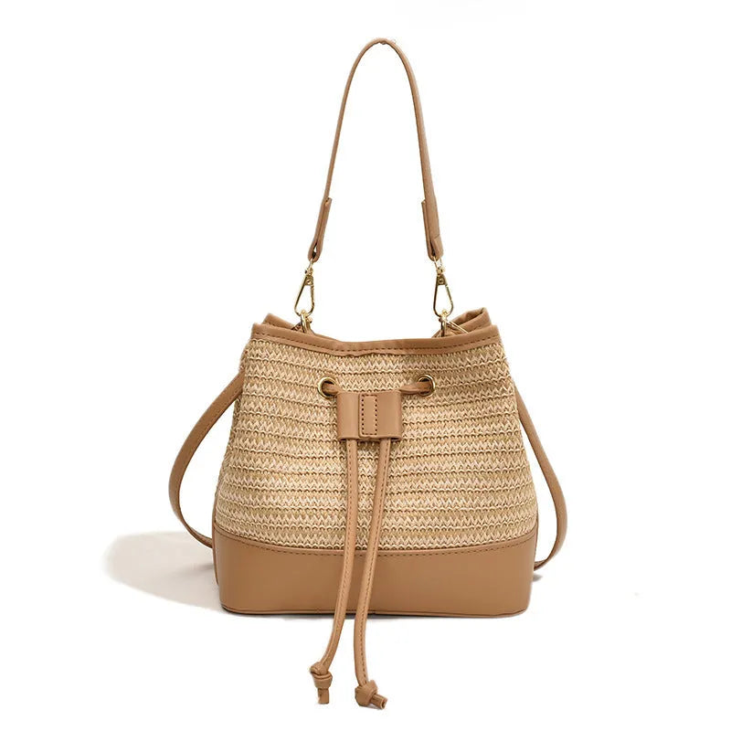 Woven straw women's crossbody bucket bag in brown colour with adjustable strap