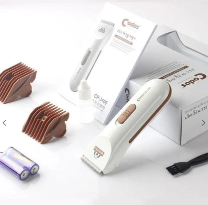 White electric pet hair clipper with ceramic blade showing battery compartment
